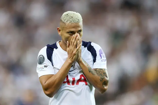 Richarlison covers his face as he reacts to his shot being saved