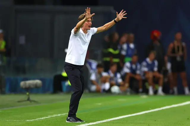 Frank waves at his players