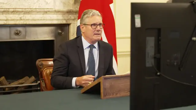 Keir Starmer in front of computer screen