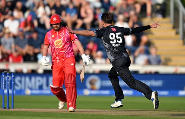 Sonny Baker of Manchester Originals celebrates after taking the wicket of Jonny Bairstow