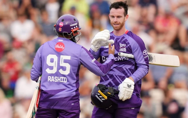Northern Superchargers' Graham Clark (right) celebrates hitting a six with Adil Rashid to win the match