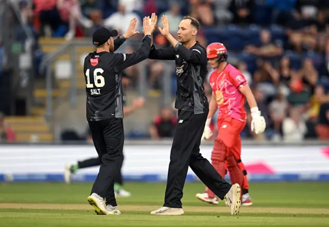 Tom Hartley of Manchester Originals celebrates with team mate Phil Salt after taking the wicket of Tom Kohler-Cadmore of Welsh Fire (not pictured)