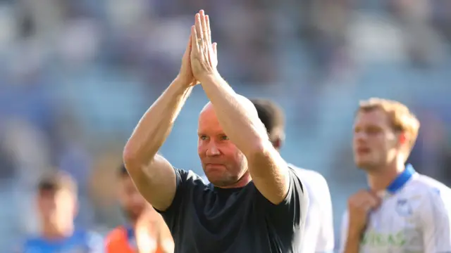 Henrik Pedersen with hands clasped in prayer