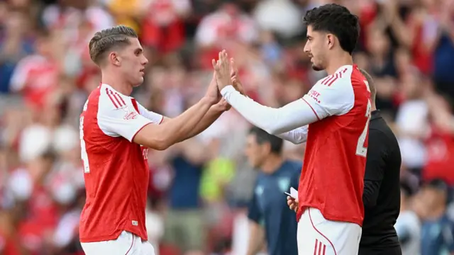 Viktor Gyokeres of Arsenal high fives Kai Havertz following substitution during the pre-season friendly match between Arsenal and Athletic Club at Emirates Stadium