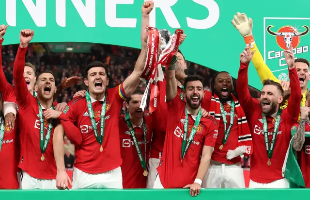 Bruno Fernandes and Harry Maguire of Manchester United lift the Carabao Cup trophy