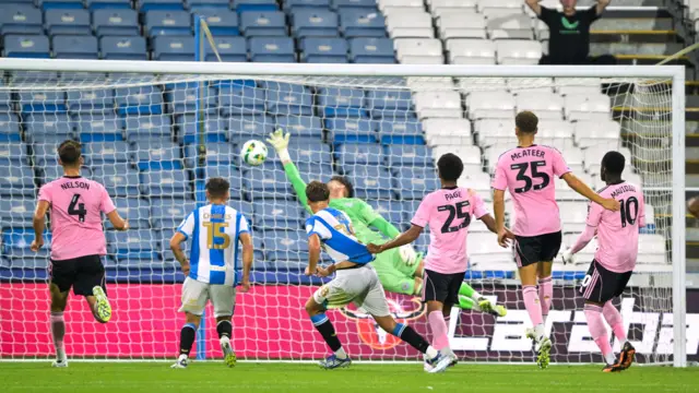 Dan Vost of Huddersfield Town scores the equalising goal 1-1 from the rebound after a penalty