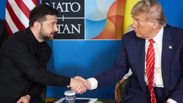 Zelensky and Trump shake hands as they meet at a Nato summit in June