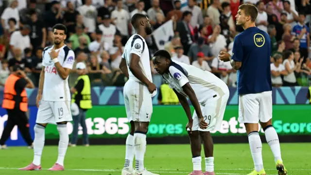 Spurs players stand dejected