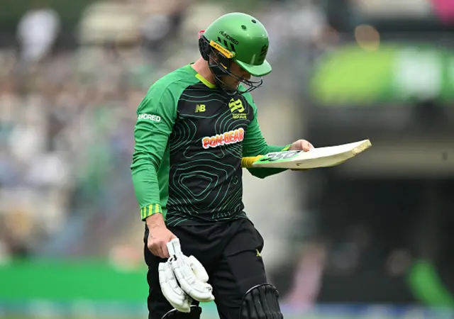 Jason Roy inspects the bat