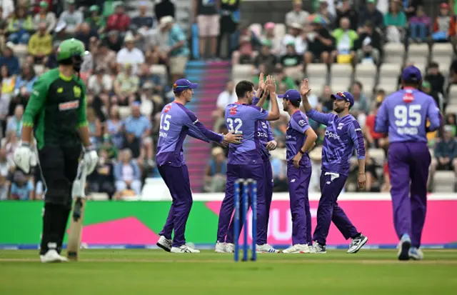 Jacob Duffy of Northern Superchargers celebrates with team mates after taking the wicket of James Vince