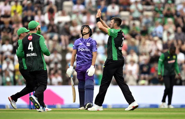 Craig Overton of Southern Brave celebrates with team mates after taking the wicket of Michael Pepper
