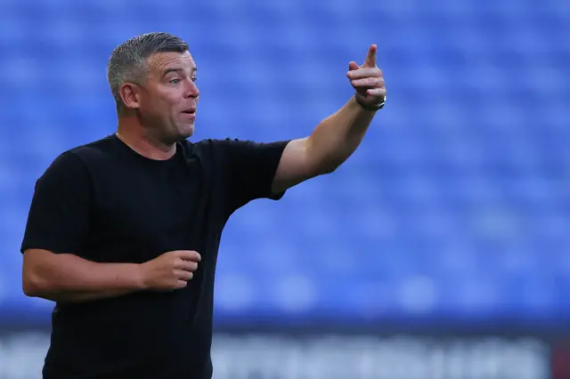 Steven Schumacher, head coach of Bolton Wanderers, issues instructions