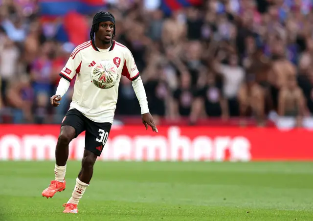 Jeremie Frimpong of Liverpool controls the ball