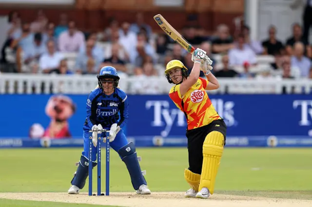 Nat Sciver-Brunt of Trent Rockets bats as wicket keeper Georgia Redmayne of London Spirit looks on