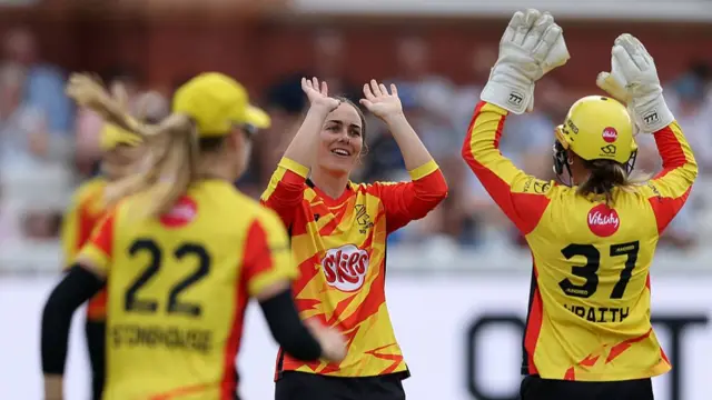 Heather Graham and Nat Wraith celebrate taking a wicket vs London Spirit.
