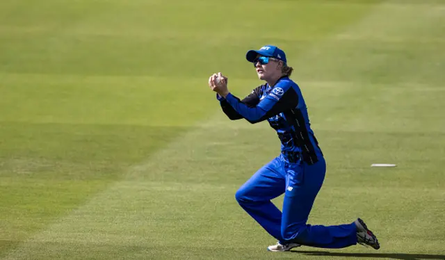 Charlie Dean of London Spirit taking a catch to dismiss Emma Jones