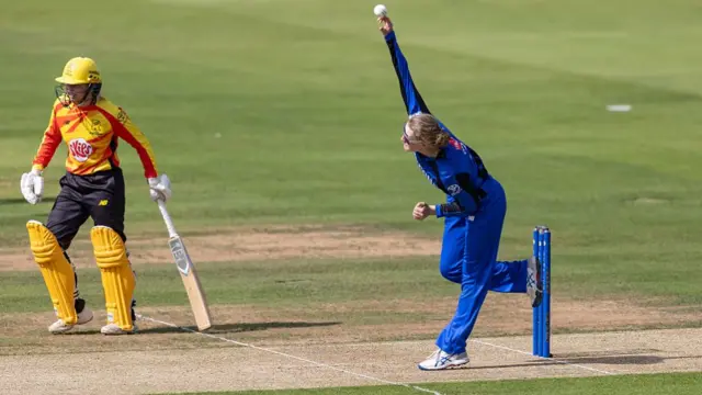 Charlie Dean mid bowling action for London Spirit v Trent Rockets