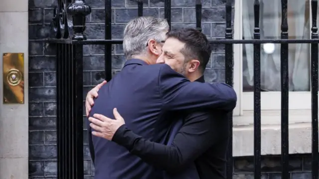 British Prime Minister Keir Starmer (L) hugs Ukrainian President Volodymyr Zelensky at 10 Downing Street in London, Britain, 14 August 2025