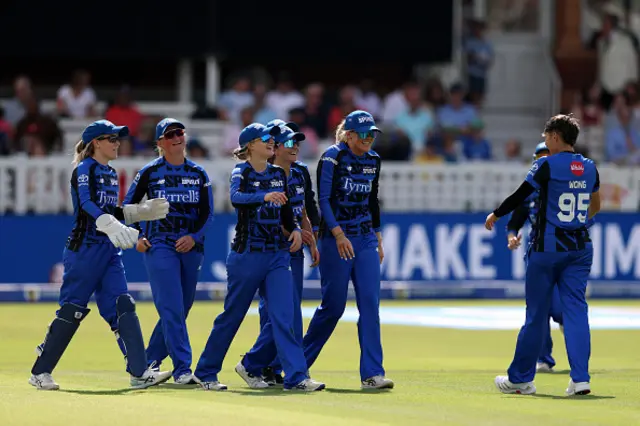 Issy Wong of London Spirit celebrates with team mates Charli Dean and Sarah Glenn after taking the wicket of Alana King