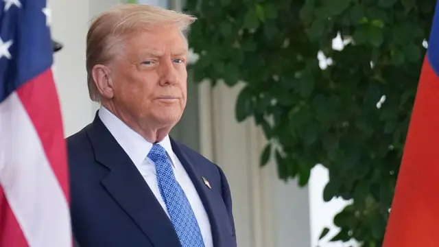 Trump stands outside the White House