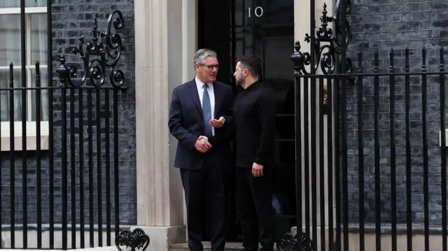 Starmer and Zelensky shake hands on the doorstep of Number 10