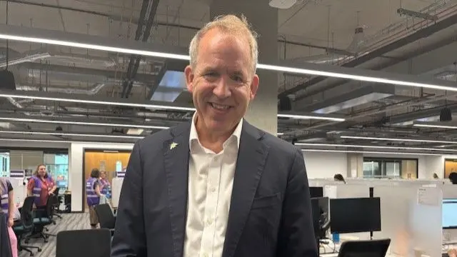 University of Manchester president and vice chancellor Duncan Ivison - he is standing in an office and looking to camera for the photo