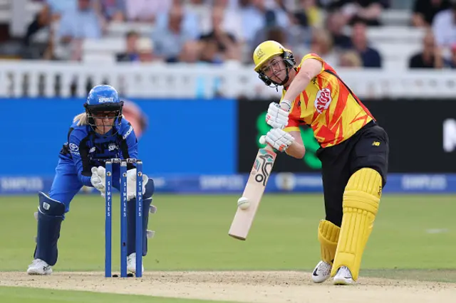 Nat Sciver-Brunt of Trent Rockets bats as wicket keeper Georgia Redmayne of London Spirit looks on