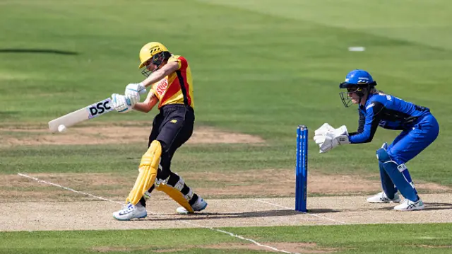 Ash Gardner of Trent Rockets hits out as wicketkeeper Georgia Redmayne