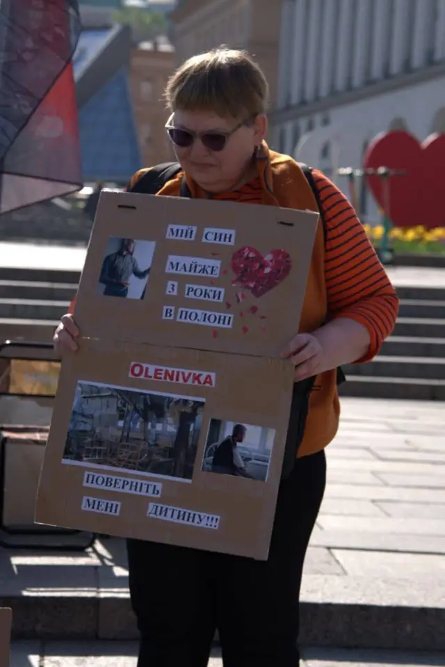 Picture of Iryna holding a placard