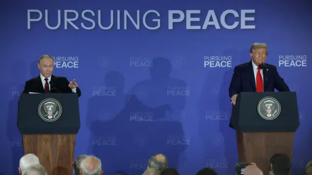 Trump and Putin standing at podiums with a backdrop reading "pursuing peace" behind them