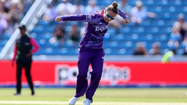 Linsey Smith celebrates taking a wicket