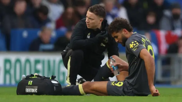 Dominic Calvert-Lewin lying on the pitch after picking up an injury