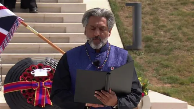 Ganatra standing and reading account