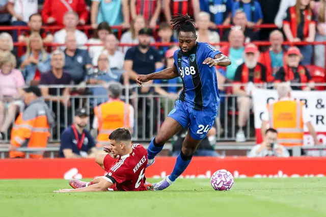 Kerkez slides into a challenge as Semenyo dances past him