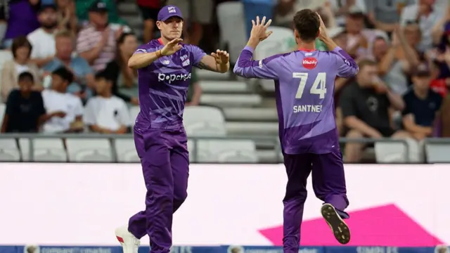 Potts and Santner celebrate taking the wicket of Smeed