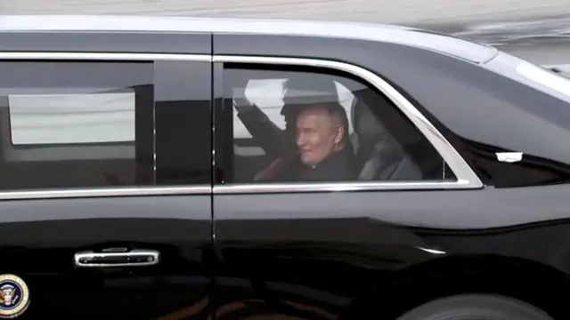President Donald Trump and Russian President Vladimir Putin share a laugh in the Us presidential car