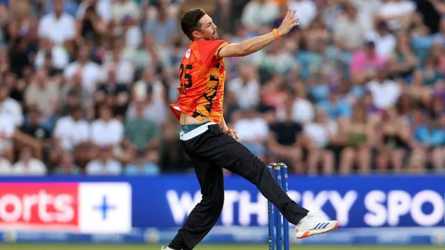 Chris Wood mid-bowling action