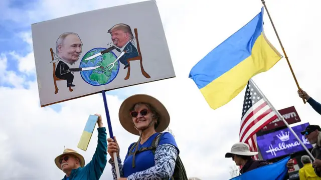 People rally in support of Ukraine in ahead of Donald Trump and Vladimir Putin's summit in Anchorage, Alaska on 14 August 2025.