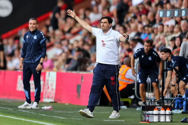 Iraola waves his arms on the touchline during a pre-season friendly