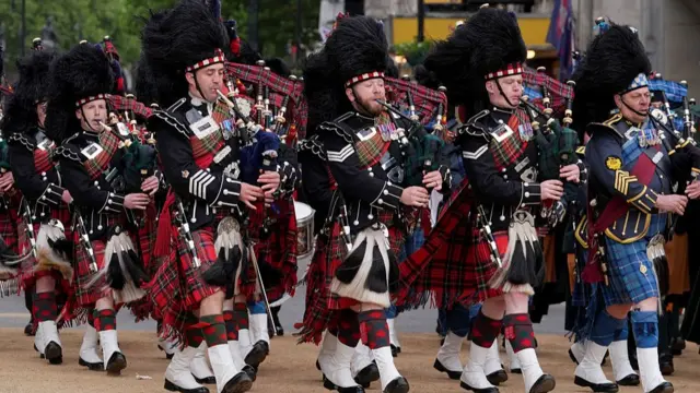 Scottish regiments procession playing bagpipes