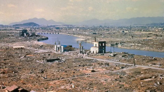 Aerial view of Hiroshima left in ruins with a river running through the destruction