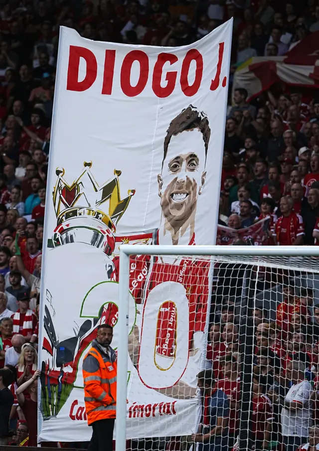 Jota banner is held up in the Kop