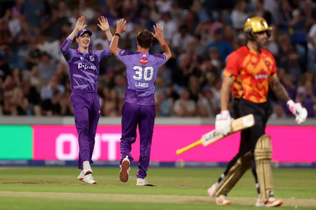 Tom Lawes of Northern Superchargers celebrates with team mate Harry Brook after taking the wicket of Benny Howell
