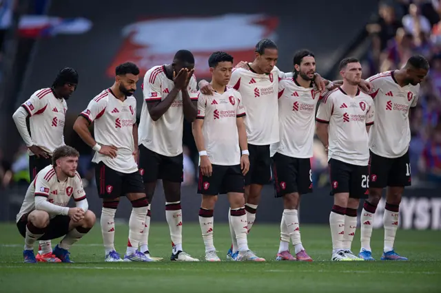 Liverpool players react to a missed penalty in the charity shield