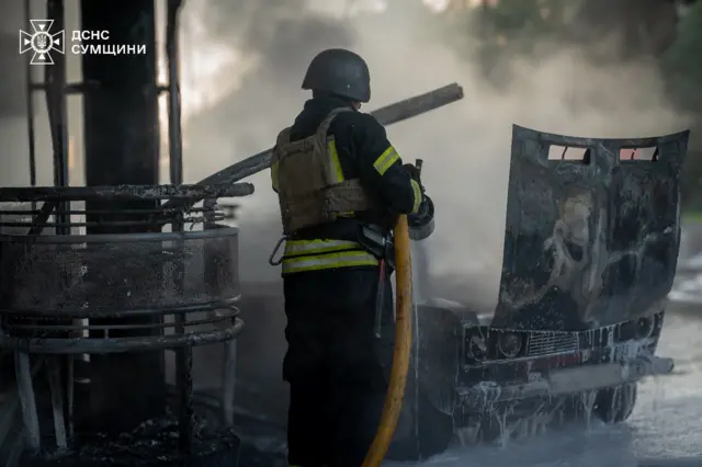 Firefighter tackles petrol station blaze