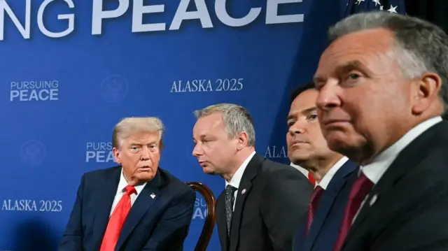 The men men sit in a row