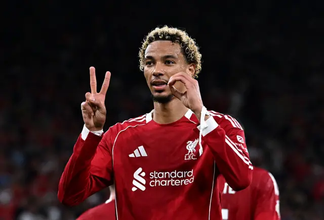 Ekitike makes a 20 sign with his hands after scoring in tribute to Jota