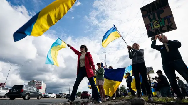 People rally in support of Ukraine in ahead of Donald Trump and Vladimir Putin's summit in Anchorage, Alaska on 14 August 2025.
