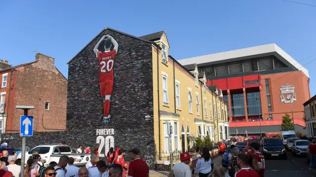 Diogo Jota mural outside Anfield is surrounded by fans