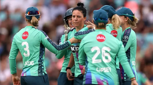 Marizanne Kapp of Oval Invincibles celebrates with teammates